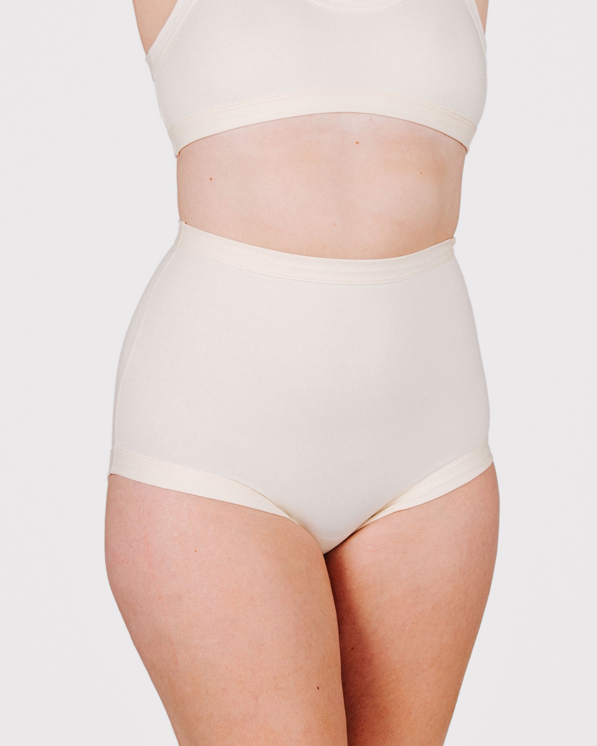 Fit photo from the front of Thunderpants organic cotton Sky Rise style underwear in off-white on a model.