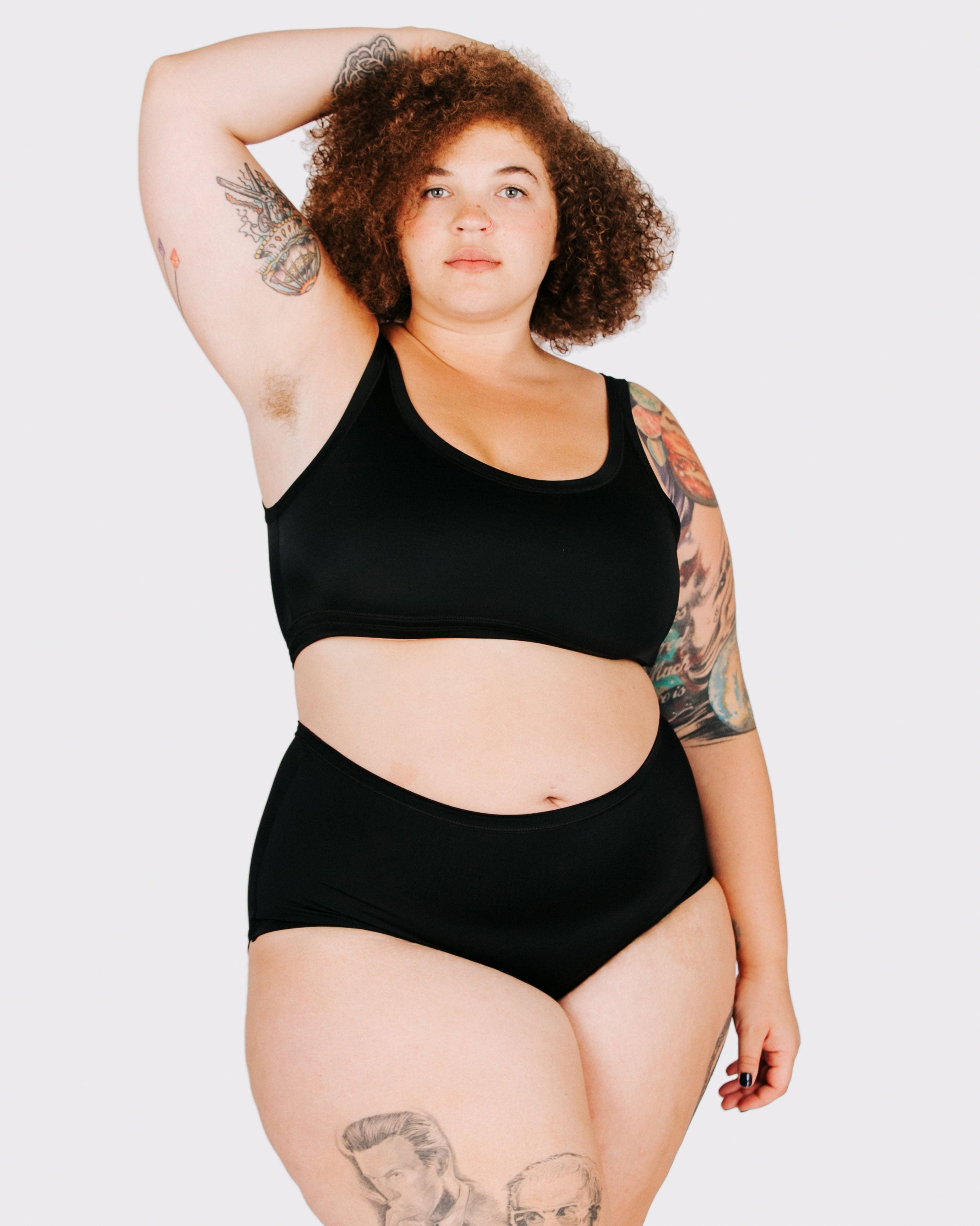 Fit photo from the front of Thunderpants recycled nylon Swimwear Original style bottoms in Plain Black on a model.
