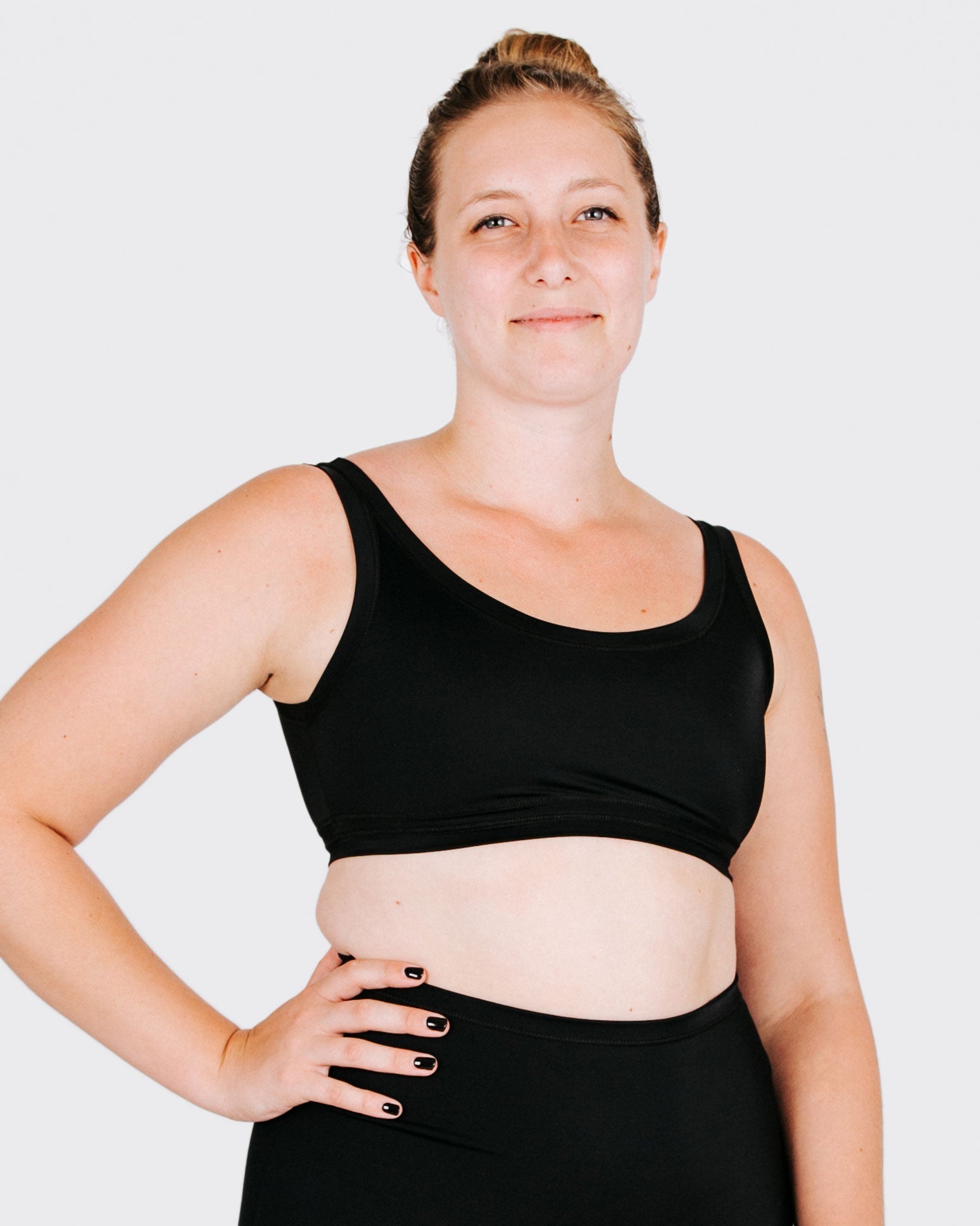 Fit photo from the front of Thunderpants recycled nylon Swimwear Top in Plain Black on a model.