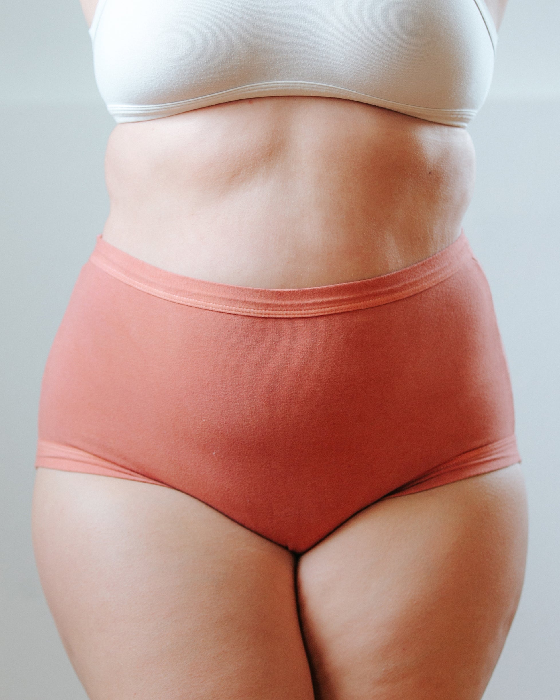 Front photo showing Thunderpants Organic Cotton original style underwear in hand dyed Terracotta color on a model.