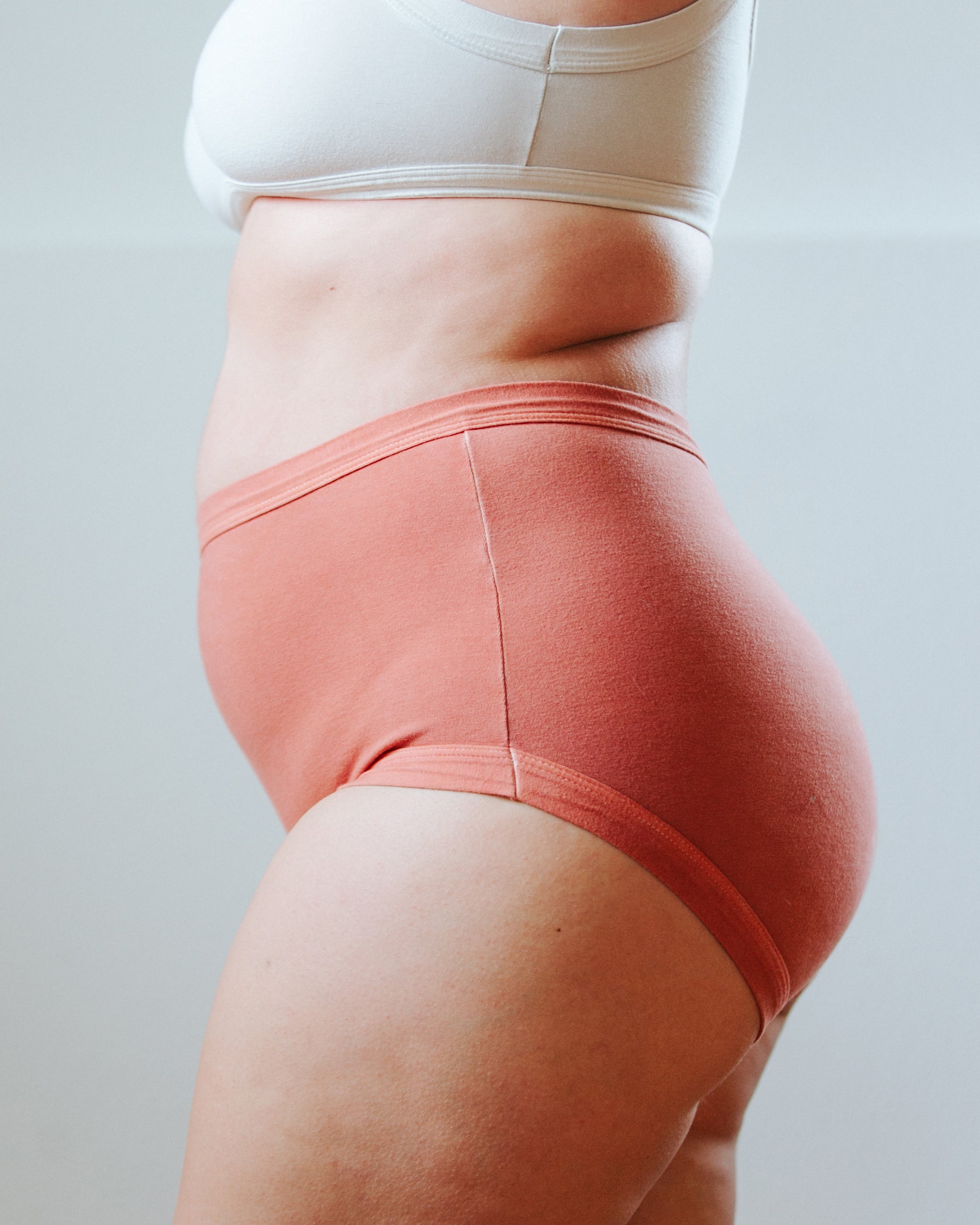Side photo showing Thunderpants Organic Cotton original style underwear in hand dyed Terracotta color on a model.