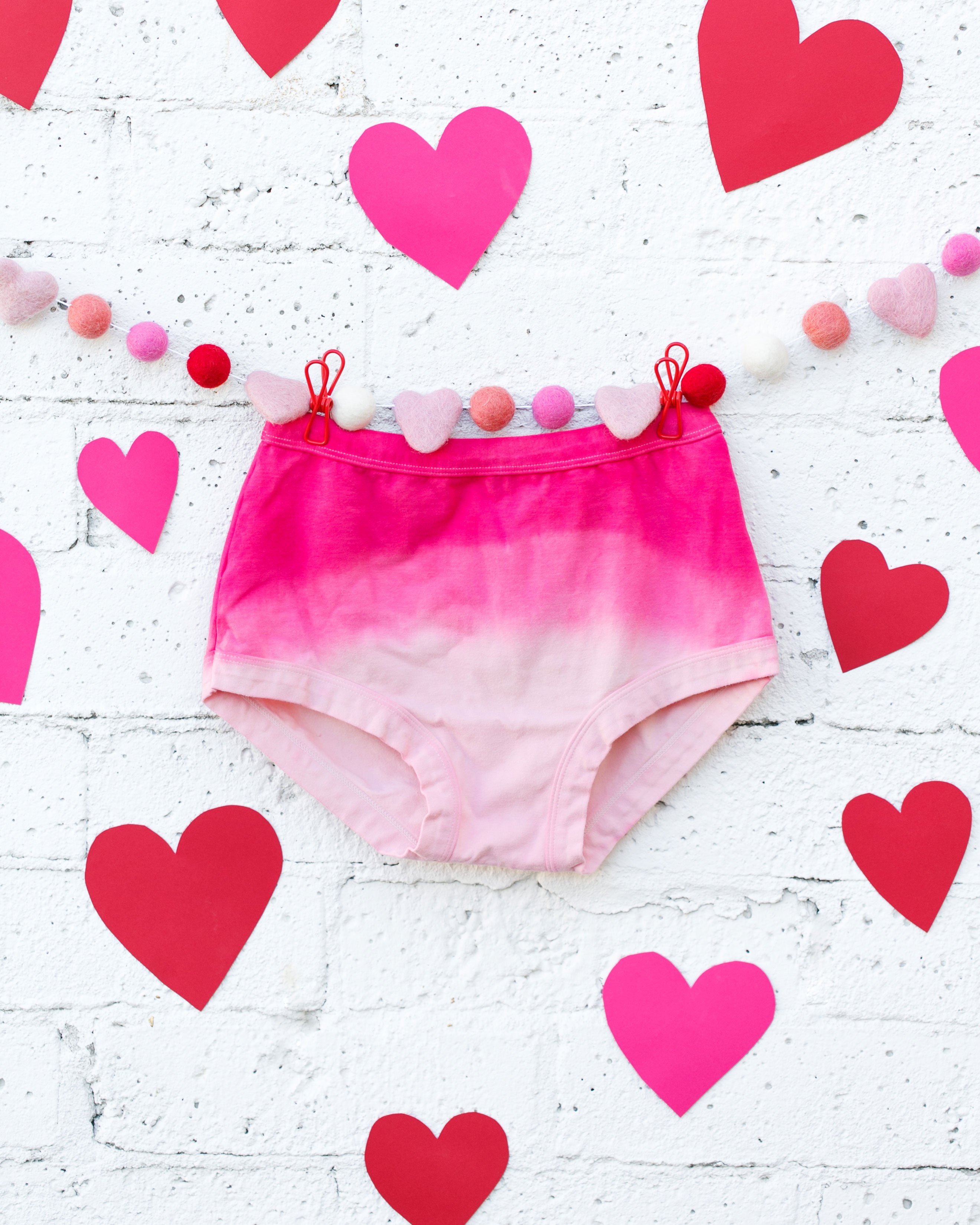 Photo of Thunderpants organic cotton Original underwear in Valentine's Day Dip Dye ombre pinks with hearts around.