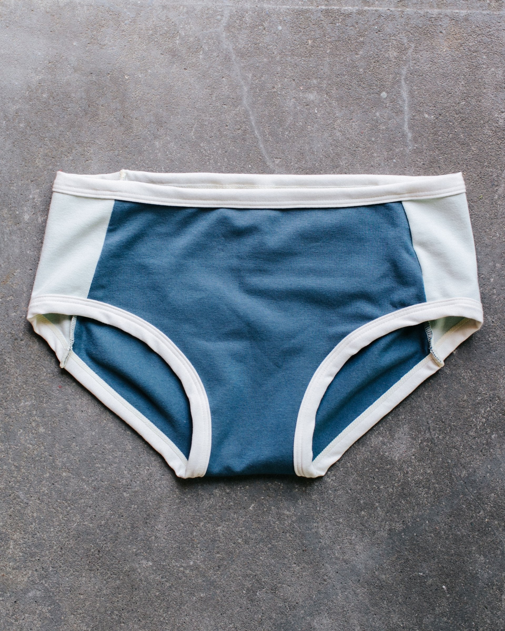 Thunderpants organic cotton Hipster Panel Pant style underwear with stormy blue center and dried sage sides.